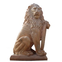 Lion holding shield statue