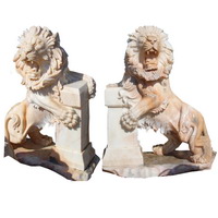 Lion statues in front of house